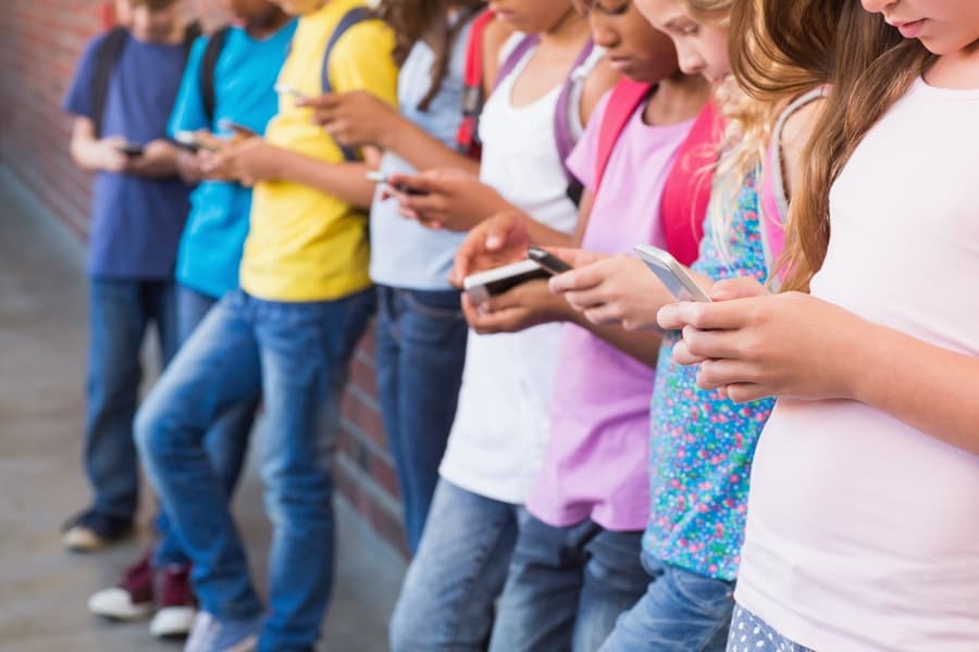 Kids with phones — the moment families look for a gentler first option